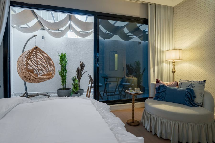 Classic Studio bedroom opening onto a patio