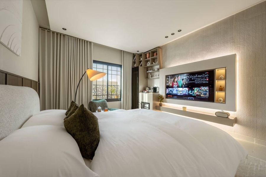 Luxury Studio bedroom with a wall-mounted smart TV